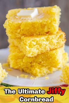 three pieces of yellow cake sitting on top of a white plate