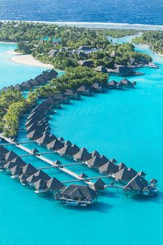 an aerial view of the overwater resort in bora bora, french polynesian