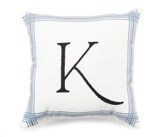 a white pillow with the letter k in black embroidery on it's front and back