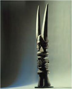 a black sculpture with two large horns sticking out of it's sides