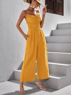 This Solid Colored Cami Jumpsuit is perfect for a casual and comfortable look. Featuring a plain pattern, it is detailed with ruched accents that provide an added touch of texture. With a regular fit and a high waist, it has spaghetti straps and a long length that easily pairs with any bottoms. Black, yellow, and green are any colors you can choose and walk around with it easily. Specifications: Style: Casual Pattern Type: Plain Details: Ruched, Ruched Bust Length: Long Type: Cami Fit Type: Regular Fit Neckline: Spaghetti Strap Sleeve Length: Sleeveless Waist Line: High Waist Fabric: Non-Stretch Material: Woven Fabric Composition: 100% Cotton Care Instructions: Machine wash or professional dry clean Size Chart(cm): Size US Bust Hip Size Length Thigh Waist Size XS 2 84.00 101.00 133.50/74.9 Casual Yellow Cotton Jumpsuit, Yellow Sleeveless Jumpsuits For Loungewear, Summer Solid Color Button-up Jumpsuit, Spring Yellow Wide-leg Jumpsuits And Rompers, Green V-neck Cotton Jumpsuit, Cami Jumpsuit, Comfy Jumpsuits, Long Length, Woven Fabric