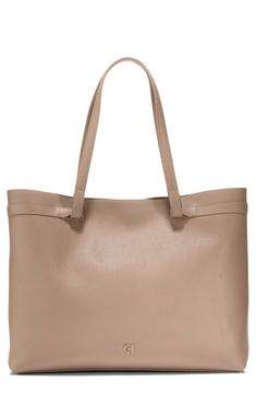 From busy workdays to quick getaways, this pebbled leather tote will become a staple with its generous size that accommodates up to a 16" laptop. Magnetic closure Shoulder straps Exterior welt pocket Interior zip, wall and smartphone pockets Fits most 16" laptops Structured silhouette with flat base for stability Lined Leather Imported Workwear Pebbled Leather Bag With Double Handle, Pebbled Leather Double Handle Bag For Work, Pebbled Leather Work Bag With Double Handle, Workwear Double Handle Pebbled Leather Bag, Double Handle Pebbled Leather Bag For Work, Classic Brown Bag With Pebbled Texture, Workwear Pebbled Leather Tote Bag, Beige Leather Bag With Pebbled Texture, Classic Satchel With Pebbled Texture For Everyday Use