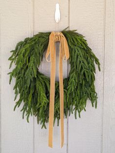 a wreath hanging on the side of a building