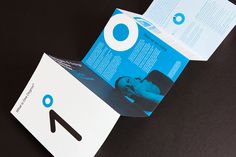 an open brochure with the letter o on it's front and back side