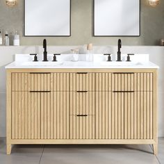 two mirrors are above the double sink vanity