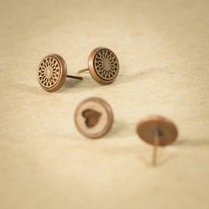 These woody stud earrings are wooden earrings made of wood and copper. These studs are the cutest wooden piece of jewelry. Made for everyday wear.  The diameter is 8 mm (0.32 inches). These lightweight Earrings are made from Black Walnut wood and protected with Natural Oil, a non-toxic finish. The durable earring hooks are nickel-free, lead-free, and hypo-allergenic. Feel the nature. SHOP POLICIES:  If you have ANY problem with your order please contact me at anytime, all situations can be solved in a friendly manner and I appreciate a kind communication. INCORRECT ADDRESS: I am not responsible for lost orders shipped for incorrect address. If your package is returned due to incorrect address I can ship it again upon postage payment. LOST ORDERS: It is very rare that a order gets lost but Natural Wood Earrings Perfect For Gifts, Wooden Earrings Studs, Wood Earring Stud, Brown Wood Drop Earrings, Wood Earrings Stud, Black Walnut Wood, Photo Proof, Wooden Earrings, Light Weight Earrings