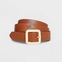 Instantly enhance any of your looks with this Chunky Center Bar Buckle Belt from A New Day™. This neutral tan belt offers easy styling with a range of outfits. It features a chunky square-shaped buckle closure for a touch of shine and chic style. This stylish women's belt with multiple holes provides an adjustable, secure fit around your waist. Whether paired with formal trousers or wrapped around the waist of a dress, this center bar belt lends on-trend flair to any outfit.

A New Day™: Style t Trendy Brown Belts With Buckle Closure, Trendy Brown Belt With Buckle Closure, Trendy Brown Belt For Workwear, Trendy Fall Belts For Workwear, Trendy Belts For Workwear In Fall, Trendy Fall Workwear Belts, Casual Belts With Buckle Closure For Spring, Brown Belts For Spring Workwear, Casual Belt With Buckle Closure For Spring