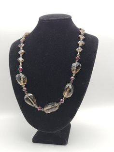 Vintage Distressed 925 Silver Beaded Garnet and Smoky Quartz Necklace  Item w#1504 Clean and in good condition  Marked 925 28.32grams 19.5 inches long with a toggle clasp. Welcome to Westgate Jewels!! We specialize in vintage estate, designer, and fine jewelry. Our shop consists of items that are estate, antique, and / or vintage conditions unless otherwise noted. This means that most items are prior owned and may have some imperfections such as light scratches, scuffs, and / or patina. Our item Formal Costume Jewelry Beaded Necklace With Polished Beads, Formal Costume Jewelry Necklace With Large Beads, Formal Large Beads Costume Jewelry Necklace, Formal Beaded Necklace With Faceted Beads, Formal Costume Jewelry Beaded Necklaces With Faceted Beads, Smoky Quartz Necklace, Vintage Native American Jewelry, Vintage Designer Jewelry, Garnet Necklace