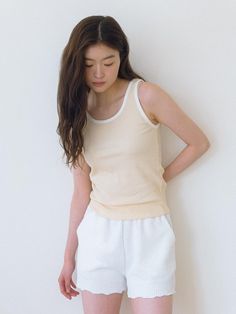 This is a feminine and minimal top by Laminez that is made out of high quality and sturdy material. With distinctive mood of the design and comfortable wear, you can style it for your refined daily outfit.- Round neckline and color detail- Ribbed fabric with tension for slim silhouette- Modern and feminine mood Beige Stretch Cotton Tank Top, Versatile Beige Tank Top For Everyday, Beige Sleeveless Top For Layering, Basic Beige Tank Top, Minimalist Sleeveless Top For Everyday, Trendy Cream Sleeveless Tank Top, Basic Beige Sleeveless Tank Top, Basic Beige Tank Top For Spring, Minimalist Sleeveless Tank Top For Everyday