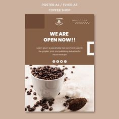 a coffee shop advert with beans in a cup and spoon