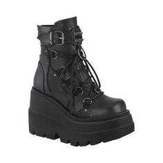 Proudly flaunt your gothic side with the Demonia Shaker-60 Wedge Heel Bootie. This wedge ankle boot features studded contrast panels and pewter-tone hardware on the front center vamp, including a horseshoe ring and large O-ring that give it a bold, edgy look. Vegan-friendly Dual buckle detail Studded contrast panels and pewter-tone hardware on front center vamp Horseshoe ring detail Spike studded metal plate Large O-Ring Metal back zipper closure Synthetic insole Synthetic outsole. Size: Size 9. Gothic Boots, Demonia Shoes, Punk Shoes, Vegan Leather Boots, Punk Boots, Black Platform Boots, Buckle Ankle Boots, Metal Plate, Lace Up Ankle Boots