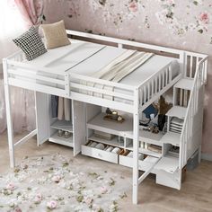 a white bunk bed with drawers underneath it