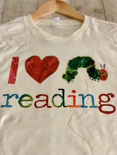 Available in size: S, M, L, XL All sizes are currently in stock, 100% cotton, soft material. Perfect for any Eric Carle fan or a primary teacher, or anyone who loves reading. Why not? Spark some love for reading & inspire young minds. It only take an adult to open up a book & let a child's imagination blossom. I'm a fan myself so I hope you guys like it. Thanks for visiting my shop. Funny Cotton T-shirt With Heat Transfer Vinyl, Primary Teacher, Primary Teachers, Eric Carle, Hungry Caterpillar, I Love Reading, Love Reading, Open Up, Caterpillar