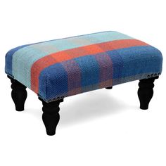 a blue and orange plaid footstool with black legs on an isolated white background