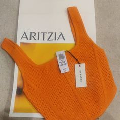 Aritzia Sculpt Knit Bustier In Citrine Orange. New With Tags Beach Fitted Pointelle Knit Crop Top, Beach Pointelle Knit Fitted Crop Top, Fitted Sleeveless Pointelle Knit Crop Top, Aritzia Sculpt Knit, Patterned Crop Top, Plaid Crop Top, Aritzia Tna, Green Crop Top, Sport Tank