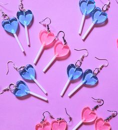 𝓐 𝓼𝔀𝓮𝓮𝓽 𝓽𝓻𝓮𝓪𝓽 𝓳𝓾𝓼𝓽 𝓯𝓸𝓻 𝔂𝓸𝓾.  Sweeten your style with these heart-shaped lollipop earrings. Featuring charms of pastel pink resin with a touch of glitter, these lightweight dangly earrings offer a playful pop of color and charm. Size: 4.8 cm x 1.8 cm Playful Pink Heart Earrings For Gift, Playful Pink Heart Earrings As Gift, Playful Pink Heart Earrings For Valentine's Day, Sweet Pink Heart Dangle Earrings, Sweet Pink Dangle Heart Earrings, Sweet Pink Heart-shaped Earrings, Cute Pink Heart Earrings For Birthday, Pink Heart Resin Earrings, Playful Heart Shaped Party Earrings