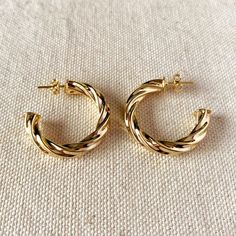 Add some playful flair to your outfit with our Twisted Half Hoop Earrings! These unique hoops feature a twisted design that adds a touch of personality to your look. Perfect for any occasion, these earrings will surely turn heads (in the best way possible)! 18k Gold filled Dimensions: 30 mm external diameter x 5 mm wide tube Weight: 0.19 oz (5.37 g) Hypoallergenic and water-friendly Handcrafted in Brazil Style Twists, Jewelry Website Design, One Earring, Earrings Aesthetic, Gold Girl, Casual Jewelry, Jewelry Essentials, Fancy Jewelry, Girly Jewelry