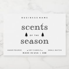 a white business card with the words scents of the season on it in black ink