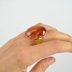 This Ks Mood Rings Features Vibrant Shades Of Resin Set In Gold-Tone Metal That's High On The Shine Scale. Pick A Color (Or A Few) That Speaks To You, And Style It With The Other Rings From Your Dish. Handcrafted Size 6 Weight: 20.35g Diameter Of Setting: 0.75" Band Width: 1" Ring Does Not Change Color Ks_ring_moon_br_6 Kate Spade Elegant Gold Ring, Elegant Kate Spade Gold Rings, Modern Brown Rings For Gift, Modern Brown Rings For Gifts, T Ring, Mood Rings, Ring Moon, Pick A Color, Mood Ring