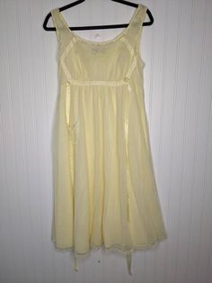 Beautiful 1950's or 1960's Vintage Munsingwear Chiffon lace nightgown. Beautiful Sleeveless Yellow nightgown with chiffon and lace throughout. One dainty front pocket. Lined Vintage size 36, equivalent to a US Small or size 6 Great pre-owned condition, no notable flaws ET08 Sleeveless Lace Bodice Nightgown For Summer, Vintage Sheer Nightgown For Summer, Sleeveless Nightgown With Lace Bodice, Vintage Sheer Sleeveless Sleepwear, Vintage Sleeveless Sheer Sleepwear, Vintage Sheer Lace Nightgown, Vintage Sheer Dresses For Bedtime, Vintage Sheer Lace Sleepwear, Vintage Sleeveless Nightgown For Spring