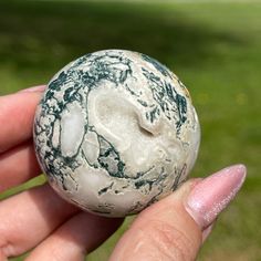 A Small Green, Blue and Grey Moss Agate unlike any other ! The patterns , the colors are stunning 😍 . The Colors are Amazing, size approximately ( see pictures MM )  This is NOT a mini carving. 📌 Science & Origin : Moss Agate prevents hypoglycemia and dehydration, treats infections, colds and flu, and lowers fevers. Helps to recover from illness. Is an anti inflammatory and boosts the immune system.  Facilitates a connection with nature (especially to the plant kingdom) Balance the chakras, specially the Root and Heart chakra.  Promotes spiritual growth and helps to heal the physical body. Instills confidence while promoting joy!♥️ Relieves anxiety, worries and stress! Enhances shamanic journeying while boosting intuitive knowledge (especially relating to herbalism)! Excellent Piece for Plant Kingdom, Gazing Ball, Fancy Lights, Crystal Stars, Energy Crystals, Crystal Collection, Crystal Gifts, Faceted Gemstones, Moss Agate