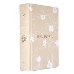 a book with white flowers on it and the words bridal sucra written in gold