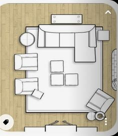 an overhead view of a living room with couches, tables and chairs in it