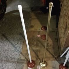 two candles are on the ground next to each other