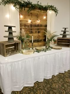 the table is set up with candles and decorations