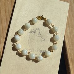 Handmade Wire (Gold) 8mm Beads White Pearl Beaded Bracelets With 8mm Beads, White Pearl Beaded Bracelets With Gemstone Beads, White Beaded Chain Bracelets, Everyday White Pearl Beaded Bracelets, Elegant White Beaded Chain Bracelet, White Gemstone Beads Bracelet For Everyday, Everyday White Gemstone Beaded Bracelets, Elegant White Beaded Bracelet With Large Beads, Christian Charm Bracelet