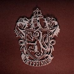 an image of a hogwarts crest cut out on the side of a wall