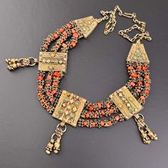 For Sale on 1stDibs - Vintage Yemeni Coral Bib Necklace, meticulously handcrafted by skilled Yemeni Jewish silversmiths. Intricately designed with gold gilt silver, adorned Bib Necklace, Necklace Handmade, Handmade Necklaces, Choker Necklace, Coral, For Sale, Silver, Gold