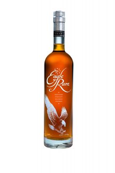 an empty bottle of eagle rare whiskey on a white background with clipping for text