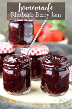 homemade rhubarb berry jam in jars on a cutting board