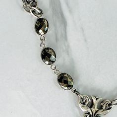 Our Sienna has been so popular we decided to add another version, one with a bit more sparkle ✨ Decorative connector and faceted pyrite beads embellish the antique silver double chain. Measures 20” in length, lobster clasp closure allows you to adjust length. All metals are electroplated with decorative finish free from cadmium, lead, and nickel. Tarnish resistant coating. Silver Hematite Necklace Gift, Elegant Gunmetal Sterling Silver Necklace, Adjustable Faceted Silver Necklace, Silver Metal Jewelry With Faceted Beads, Silver Faceted Metal Necklaces, Vintage Silver Faceted Necklace, Elegant Hematite Jewelry With Silver Beads, Interior Design Business, Double Chain