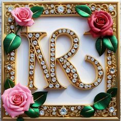 the letter rr is surrounded by roses and diamonds on a gold frame with green leaves