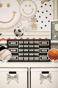 there is a basketball, soccer ball and other items on top of the dressers