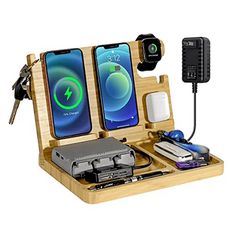 an iphone charging station with two cell phones and a charger attached to the dock