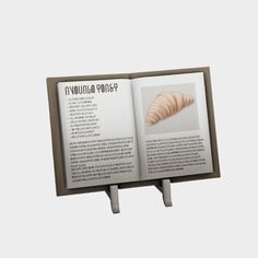 an open book on a metal stand with information about croissants in latin