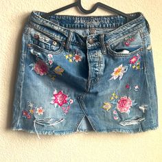 A Cute Denim Mini Skirt With Floral Embroidery From A&F. It Is Perfect For Summer !! Never Worn Embroidered Dark Wash Bottoms For Summer, Dark Wash Embroidered Bottoms For Summer, Spring Mini Skirt With Floral Embroidery, Spring Embroidered Denim Skirt, Embroidered Medium Wash Denim Skirt, Spring Embroidered Cotton Denim Skirt, Embroidered Denim Skirt For Spring, Spring Embroidered Medium Wash Denim Skirt, Denim Skirt With Floral Embroidery