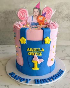 a birthday cake decorated with an image of ariel from the princess and the frog on top