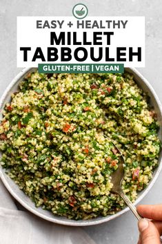 a bowl filled with tabboule and topped with a spoon