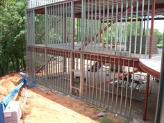 a building that is being built with metal bars on the sides and stairs to the top