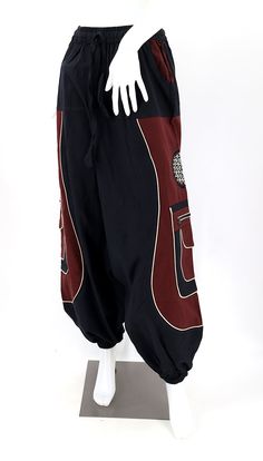 Black Embroidered Cotton Pants, Baggy Embroidered Cotton Bottoms, Traditional Fitted Pants For Festivals, Summer Embroidered Cotton Harem Pants, Red Cotton Bottoms With Floral Embroidery, Black Bohemian Bottoms With Floral Embroidery, Traditional Embroidered Cotton Bottoms, Festival Embroidered Cotton Pants, Bohemian Cotton Pants With Floral Embroidery