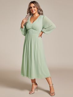 Step into any wedding celebration with confidence in our Plus Size Flowy Long Sleeves V-Neck Midi Chiffon Wedding Guest Dress. The airy chiffon fabric drapes beautifully around your curves, offering a flattering and effortless look. With its versatile midi length and long sleeves, this dress fits perfectly into any evening affair. Whether it's a grand ballroom reception or an intimate candlelit dinner, you'll feel like the belle of the ball, radiating elegance and charm in this captivating ensemble. Solid Chiffon V-neck Dress, Chiffon Wedding Dress With Ruched Bodice, Flowy Solid Chiffon V-neck Dress, Spring Wedding Chiffon V-neck Dress, Flowy Solid Chiffon Dress With V-neck, Solid Color Flowy V-neck Chiffon Dress, Chiffon Bridesmaid Dress With Ruched Bodice, Green Chiffon Wedding Dress, Elegant Green Chiffon Dress For Wedding