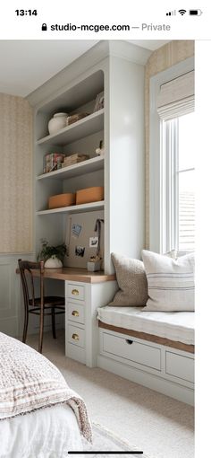 a bedroom with a bed, desk and bookcase in the corner next to a window