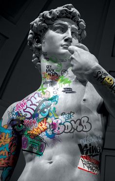 there is a man with many tattoos on his chest and arms that are covered in stickers