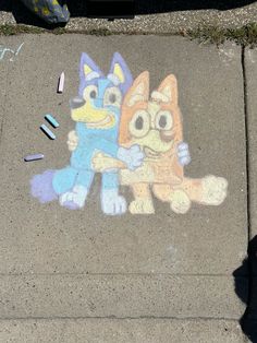 the sidewalk has been drawn with chalk and crayons