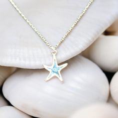 Experience the allure of the ocean with our Starfish Necklace, a beautiful addition to any summer wardrobe. Crafted from high-quality 925 sterling silver, this chain necklace is designed to capture the essence of beachside charm and elegance. Its intricate starfish pendant reflects the beauty of sea life, making it a timeless piece of summer jewelry. Whether dressing up for a special occasion or adding a touch of seaside splendor to everyday outfits, this necklace promises to be a cherished acce Beach Jewelry In Sterling Silver With Star Shape, Beach Jewelry With Sterling Silver Star, Silver Starfish Jewelry For Vacation, Ocean-inspired Jewelry With Star Charm, Ocean Color Necklace With Starfish Charm For Gift, Silver Necklace With Starfish Charm For Summer, Silver Starfish Charm Necklace For Summer, Summer Ocean-inspired Jewelry With Star Charm, Summer Ocean-inspired Star Charm Jewelry