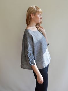 "Classic linen blouse with three quarter sleeves decorated with elegant ruffles for a feminine touch. Made from a fantastic 100% pure European linen this shirt is light and airy. An eco-friendly choice. Melange grey linen. The bell shaped cut is loose and comfortable without sacrificing style. Will look great on you with jeans and just as well with smart outfits. The top will be custom made for you with great attention to finishing. You will receive the top already softened. It won't shrink anym Semi-formal Linen Casual Tops, 3/4 Sleeve Linen Blouse For Work, Casual Linen Blouse With 3/4 Sleeves, Chic Linen 3/4 Sleeve Blouse, Linen Tops With 3/4 Sleeves And Buttons, Linen Top Women, Linen Shirts Women, Linen Dress Women, Smart Outfit